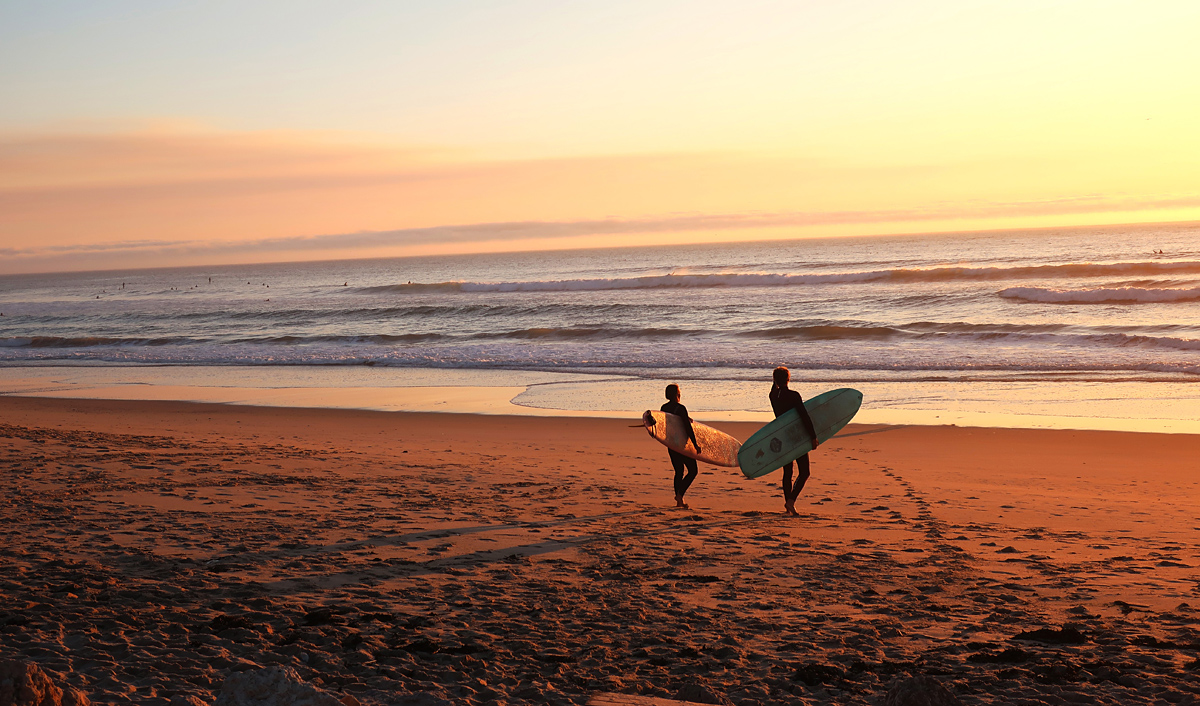 Two Surfers on the Beach - What's Your Greatest Dream? - Christ.net.au